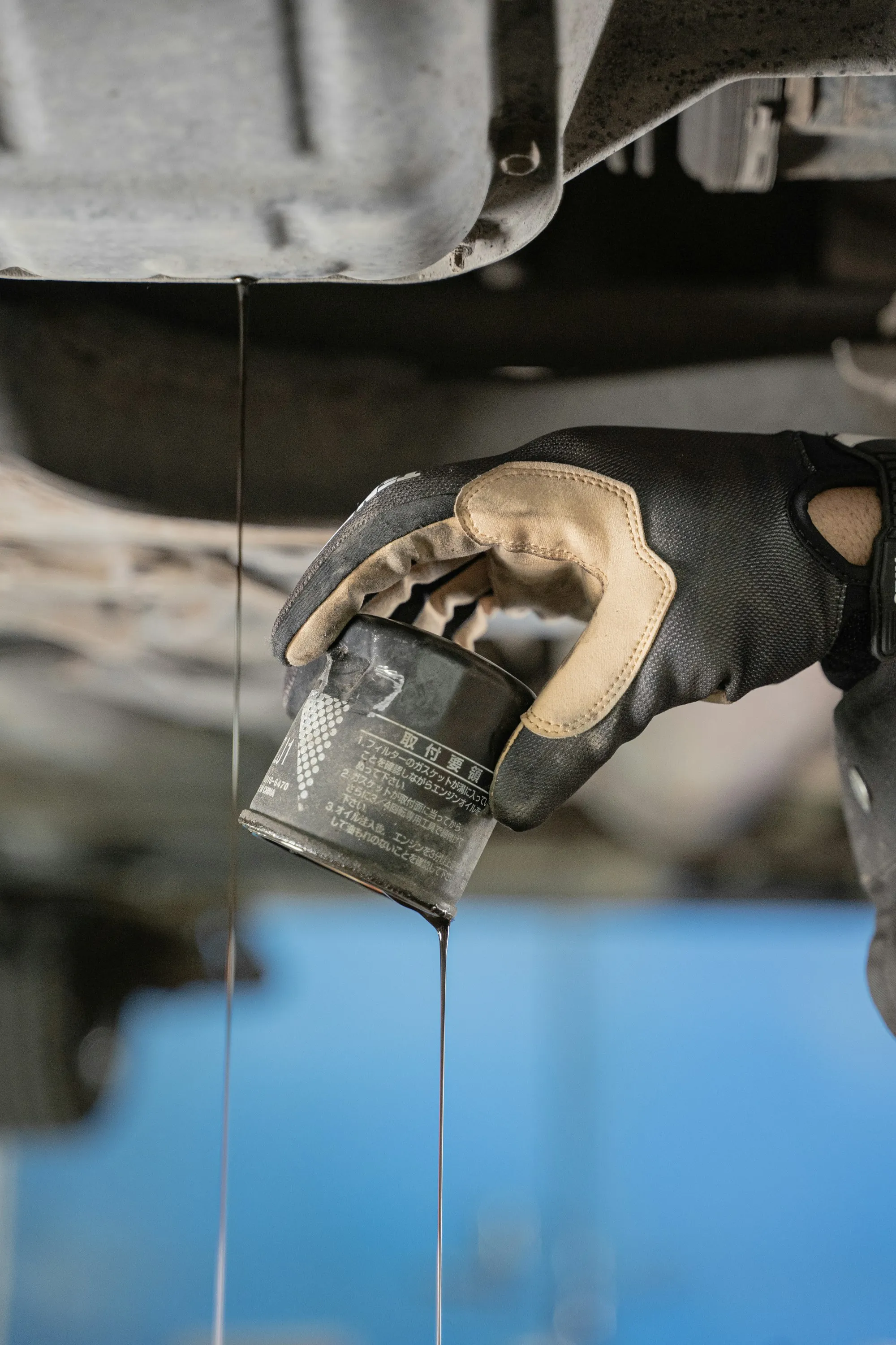Oil dripping from an engine component in close view