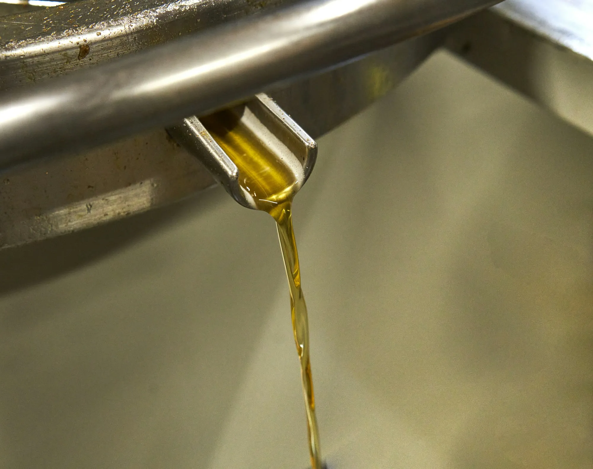 Oil being poured from a container into an engine